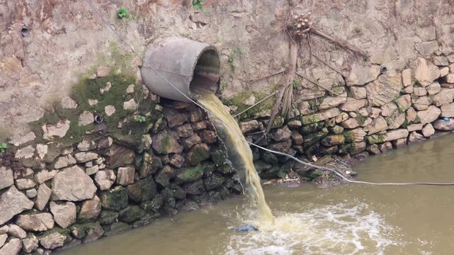 Sewage water falling into the river