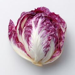 Fototapeta premium Fresh Red Radicchio Lettuce Head Vibrant Purple and White Leafy Vegetable Isolated on White Studio Background