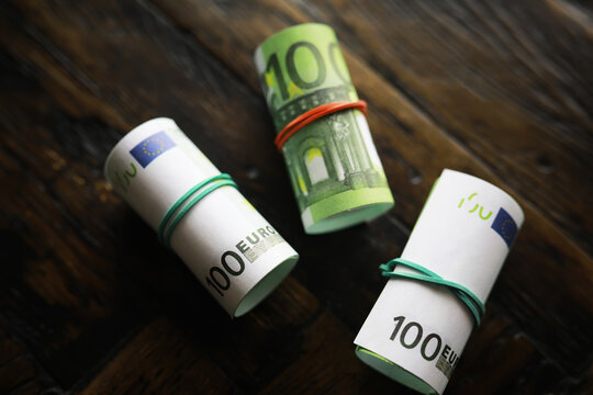 100 euro banknote pack and wood bankground. Currency, financial