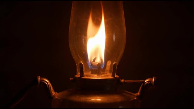 Vintage oil lamp flame rustic metal burner, antique glass lantern light and warm glow in dark night, nostalgic old fashioned illumination art with vintage oil lamp flame in dark background