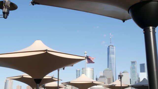 New York City Manhattan downtown financial district skyline, New Jersey Exchange Place, United States. Urban cityscape with skyscraper buildings, World Trade Center. J Owen Grundy park, Paulus Hook.