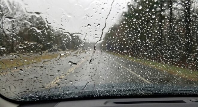 Water beading on windshield with rain repellent coating