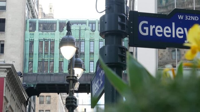 New York City Gimbels bridge, Manhattan Midtown, United States of America. Skybridge on Broadway, Herald Square, USA. Gimbels traverse on 6 avenue. Historic elevated walkway 1925. Greeley Square sign.