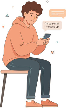 A young man sits on a chair, looking concerned while texting on his phone with an apologetic message.