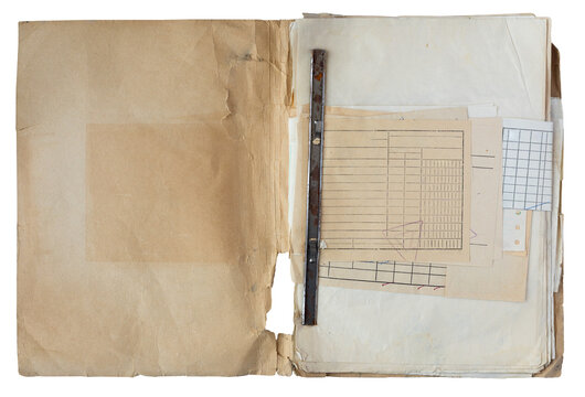 Top view of old worn paper folder with vintage accounting documents, ledger sheets and metallic binding isolated on white