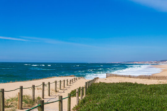 Wooden boardwalk along the Atlantic ocean coast, Portugal