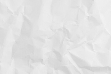 Naklejka premium Top view of white crumpled paper texture background,Macro,Close-up shot of white wrinkled and crumpled paper texture background. High resolution texture of folded paper with shadows and highlights,