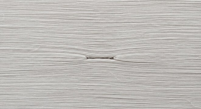 A white, textured surface with a pattern of horizontal lines and a central, intersecting line