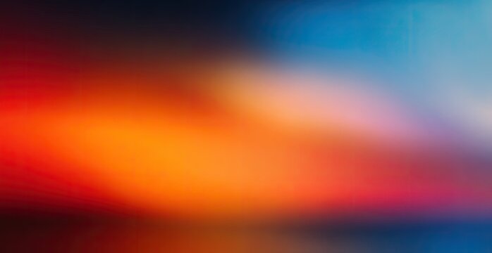 A vibrant, blurred gradient transitions from warm reds and oranges to cool blues and purples.