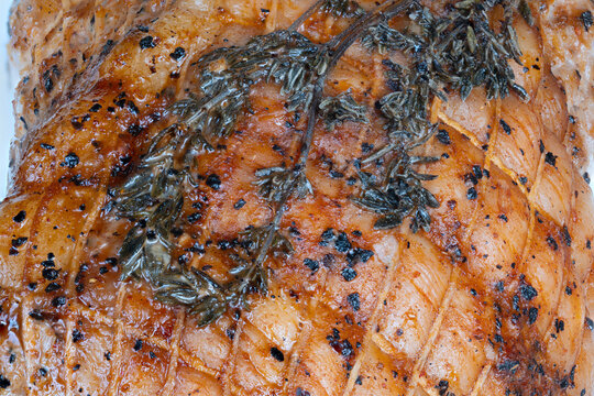 Juicy pork fillet covered in spicy caramelized crust beautifully detailed. Wellseasoned pork with crispy spiced crust showcasing caramelization and tender juicy fibers
