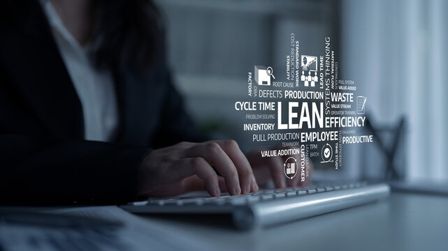 A business professional is engaged in typing at a keyboard, surrounded by key concepts of lean management, symbolizing efficiency and productivity in the workplace. Tessel