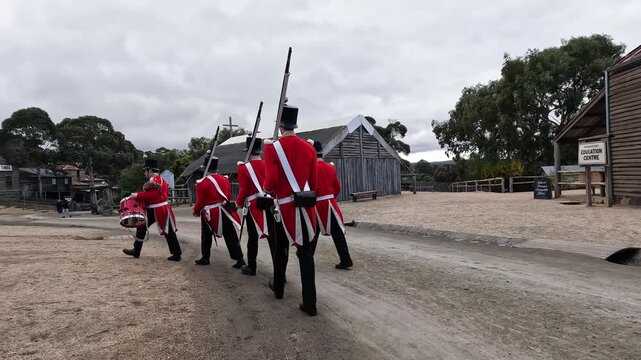 Redcoat soldiers marching in historical reenactment at Sovereign Hill Ballarat Australia.