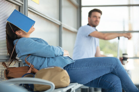 tired female traveler waiting for departure