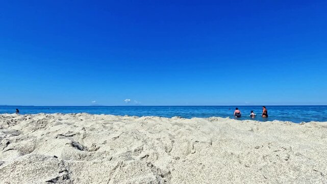Time lapse vacation day on a Sicilian beach overlooking the Mediterranean Sea. The video was shot in the seaside village of Rodia, near Messina, Sicily, in Southern Italy