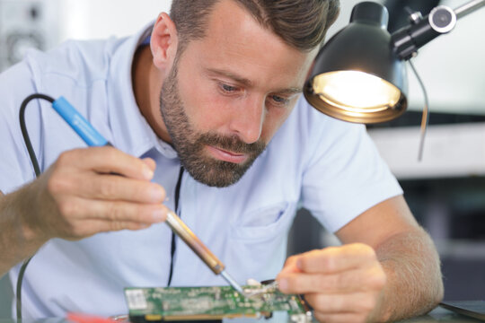 engineer working on circuit board