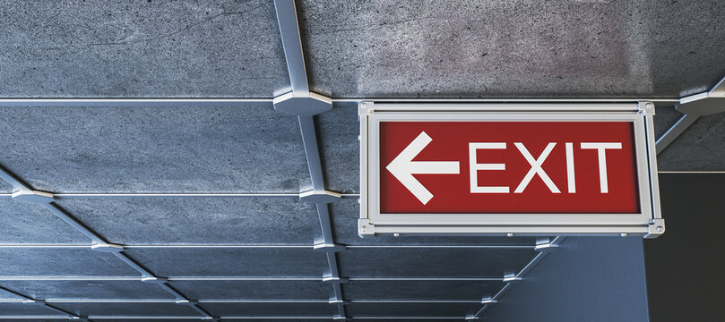Suspended red exit sign with left arrow on modern industrial ceiling interior space displayed as safety directional signage. 3D Rendering
