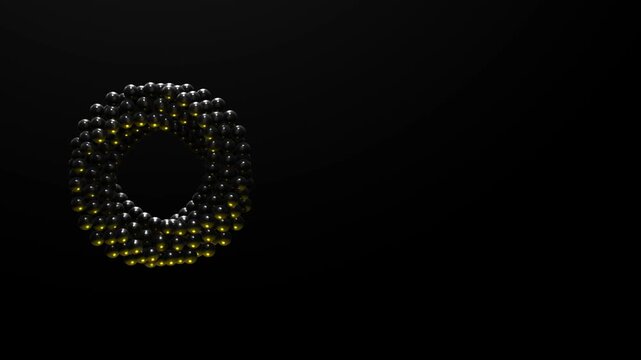 Circular arrangement of black glossy spheres forming a torus shape with golden light accents positioned on the left side for copy space