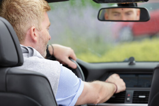 man driving a business car