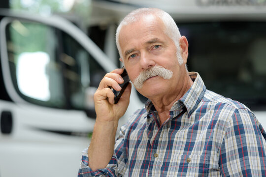 senior lorry worker on the phone