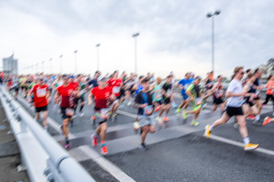 marathon runners in the city, motion blur