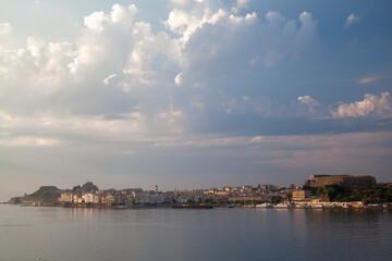 Naklejka premium Coastal Cityscape of Corfu at Sunset