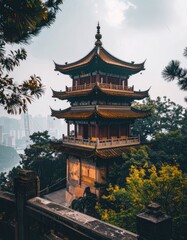 Obraz premium A stunning view of a traditional Chinese pagoda rises above a misty cityscape, showcasing intricate architectural details and a serene atmosphere.