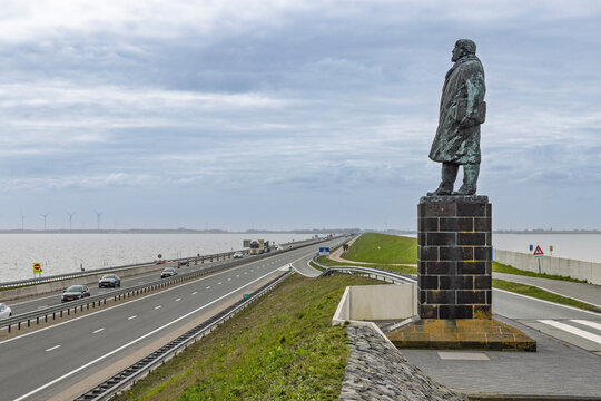 Afsluitdijk, Netherlands, April 1 2026. Large bronze statue of engineer Cornelis Lely overlooking the dike and A7 motorway.