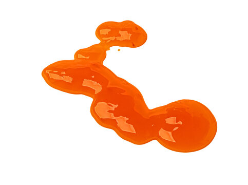 Orange liquid jam spilling on transparent background