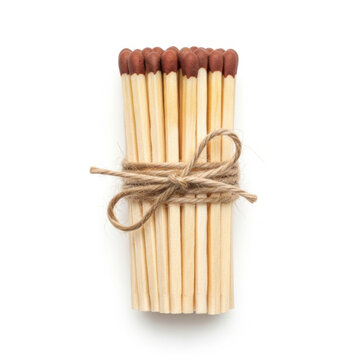 Bundle of wooden matches with brown heads tied with twine string isolated on white background