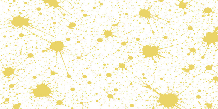 Abstract design of scattered splatters of yellow paint, creating a textured pattern. evoking creativity.