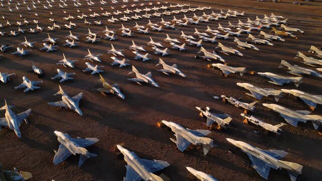 Tucson, United States - 07 April 2026: Aerial view of serried rows of aircraft glinting in the desert sun, creating a striking contrast of metal and earth.