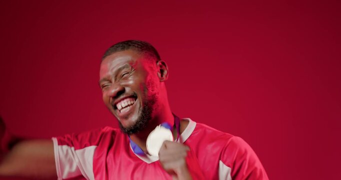 Sports athlete lifting medal to lens, biting medal, causing animated confetti and score for win