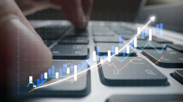 A close-up view of a hand typing on a modern keyboard, enhanced with a digital overlay of a stock market graph, portraying financial growth and analysis. Copula