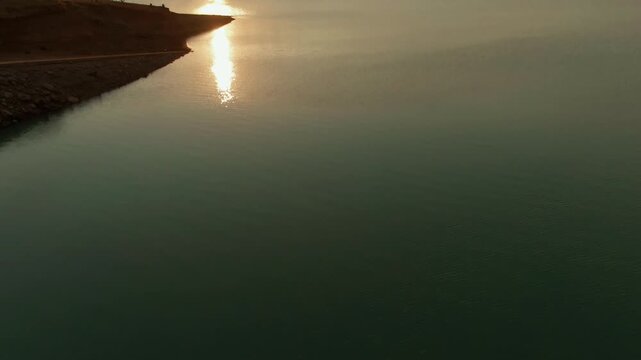 Serene Dam Of Presa Vista Hermosa During Sunset In Tamazula de Gordiano In The State Of Jalisco, Mexico. Aerial Tilt-up Shot