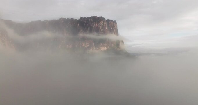Scenic View Of Tepuis (table-top mountains) During Foggy Sunrise Within Canaima National Park In Venezuela. Aerial Shot