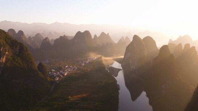 Scenic Karst Landscape Of The Li River (Lijiang River) Near Xingping At Sunrise In Guilin, China. Aerial Shot