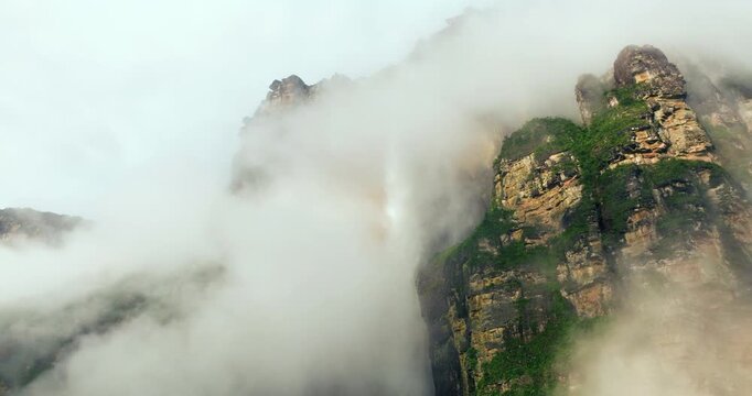Misty Clouds Covering Auy&aacute;n-tepui Mountain With Angel Falls In Venezuela. Aerial Shot
