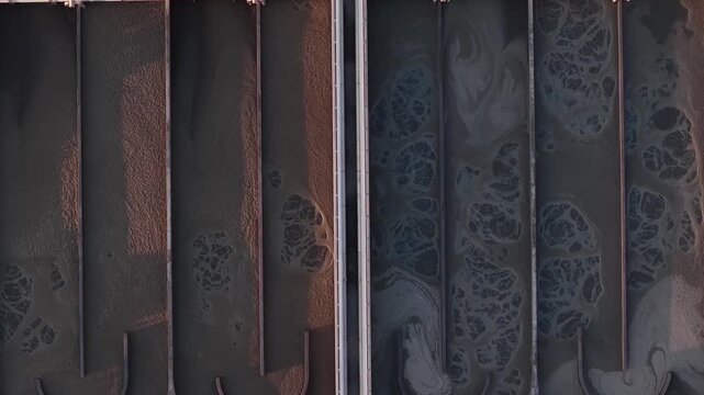 Aerial view of the industrial water treatment plant pools, contrasting the light and dark tones, Lisbon, Portugal.