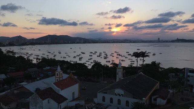 Sunset aerial over Praia do Cascalho and Praia do Trapiche with boats in Penha, Brazil.
