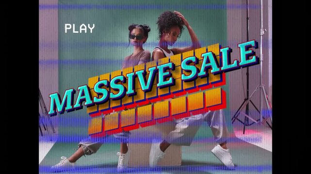Two fashion models posing green backdrop PLAY label starting animating MASSIVE SALE promoting sale