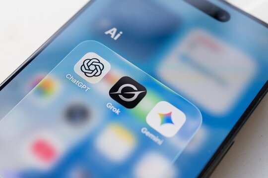 Kyiv, Ukraine - January 1, 2026: The Grock Gemini and ChatGPT logos on a smartphone screen