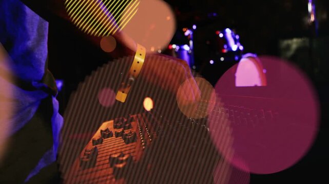 Lighting cue starting, operator hands moving on mixer, adjusting faders and knobs, balancing drums