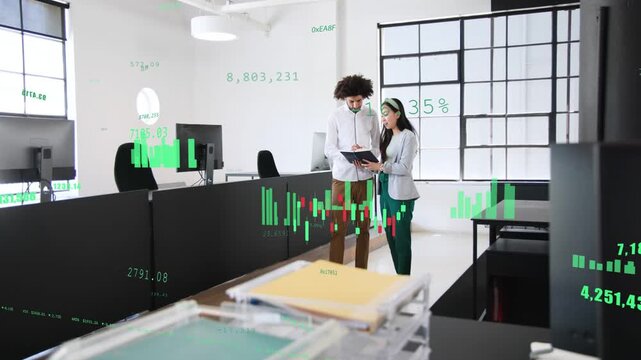 Pair walking open office opening folder, reviewing market data while green charts overlaying folder