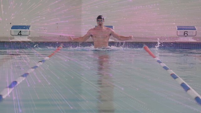Male swimmer in lane 5 surfacing, sweeping arms and kicking, making splash, propelling forward