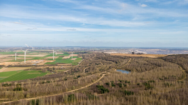 Aerial view wind farm beside Hambach open-pit mine green fields