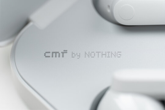 Dnepr, UKRAINE 04.08.2026 : Macro shot of the CMF by Nothing brand logo in signature dot-matrix font on a white matte surface of a tech device. Minimalist branding and texture detail. 