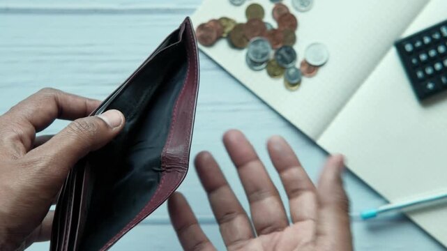male opening black leather wallet, empty wallet Unemployment during financial crisis close up