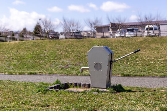 Manual water pump in a public park in Japan.