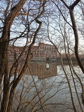 Scenic view of ruined historic Modlin Fortress reflected in river water