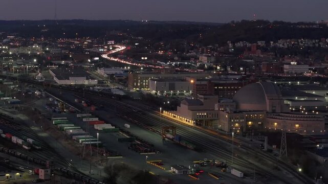 Aerial view of Cincinnati Union Terminal and surrounding cityscape illuminated against the fading twilight sky, Cincinnati, Ohio, United States.